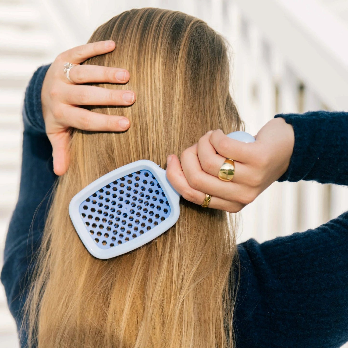 Unbrush detangling hair brush gently removes knots from long hair with its innovative design