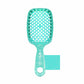 Unbrush detangling hair brush in teal with a glittery finish and flexible bristles
