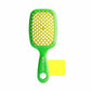 Unbrush detangling hair brush in green with a unique design for easy and gentle hair detangling