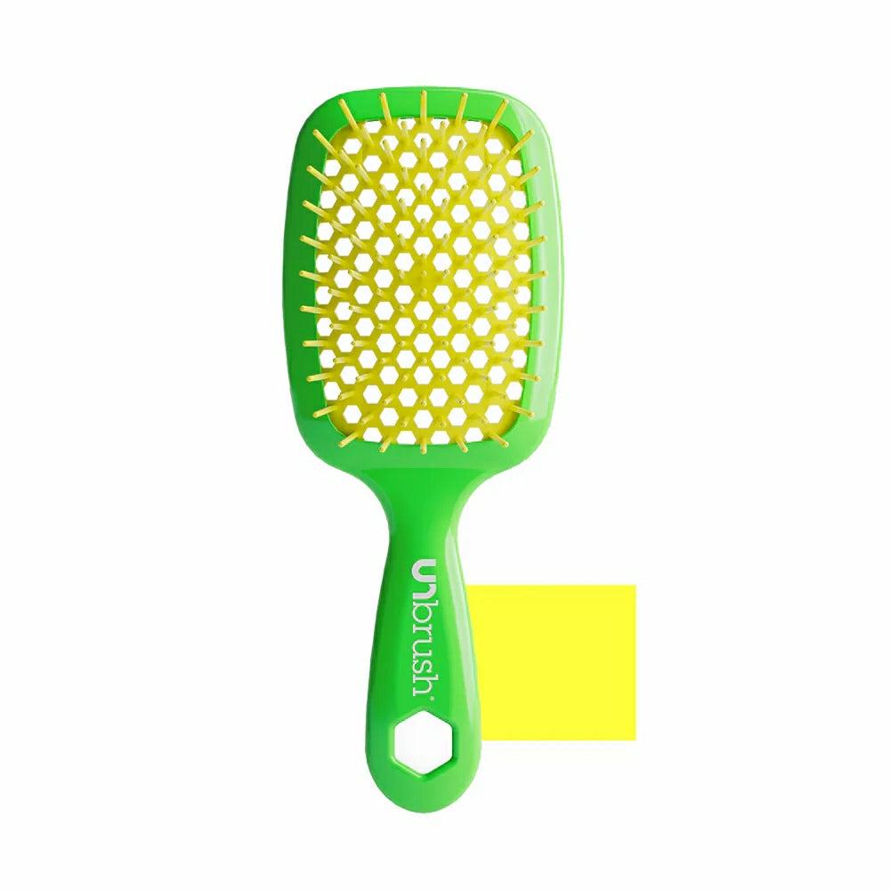 Unbrush detangling hair brush in green with a unique design for easy and gentle hair detangling