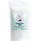 A white resealable pouch labeled Natural Elephant Fine Dead Sea Salt, 100% all natural and pure, 8 oz (225 g), with a blue and white design and elephant logo. Valued for exfoliation and therapeutic benefits.
