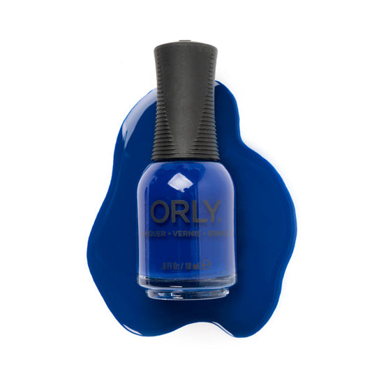 A bottle of Orly Blue Tango Nail Lacquer rests on a matching blue polish puddle against a white background—an ideal everyday nail color.
