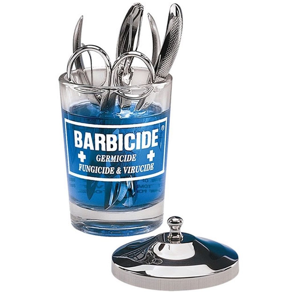 Barbicide jar for manicure table containing sterilized tools and instruments for nail care
