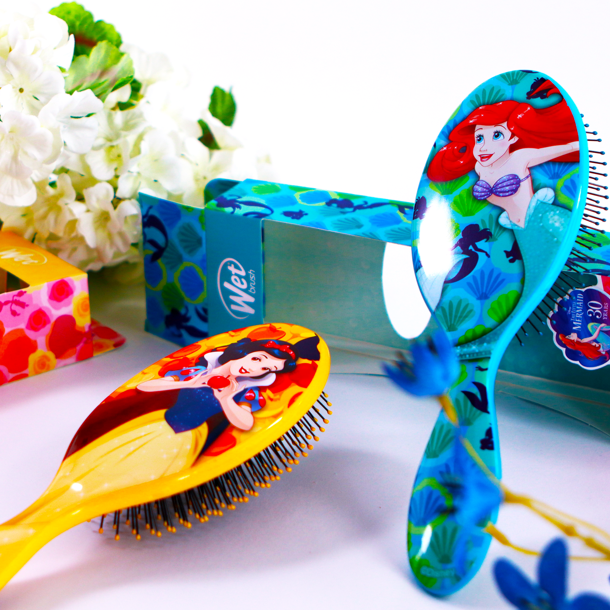 Disney Princess detangler brush featuring Ariel and Snow White for gentle and effective hair care