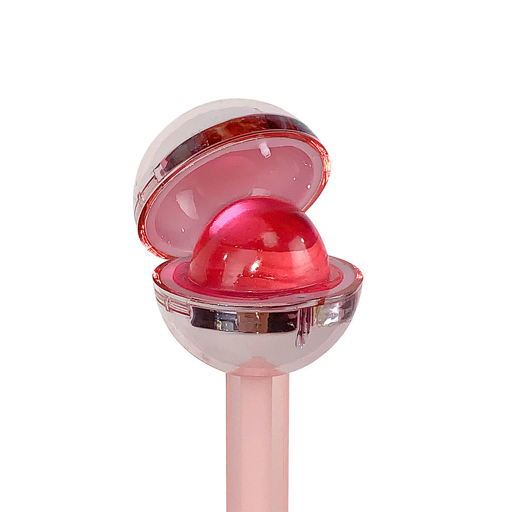 Glossy Pops Cheers lip gloss in a stylish container with a soft pink hue and reflective finish