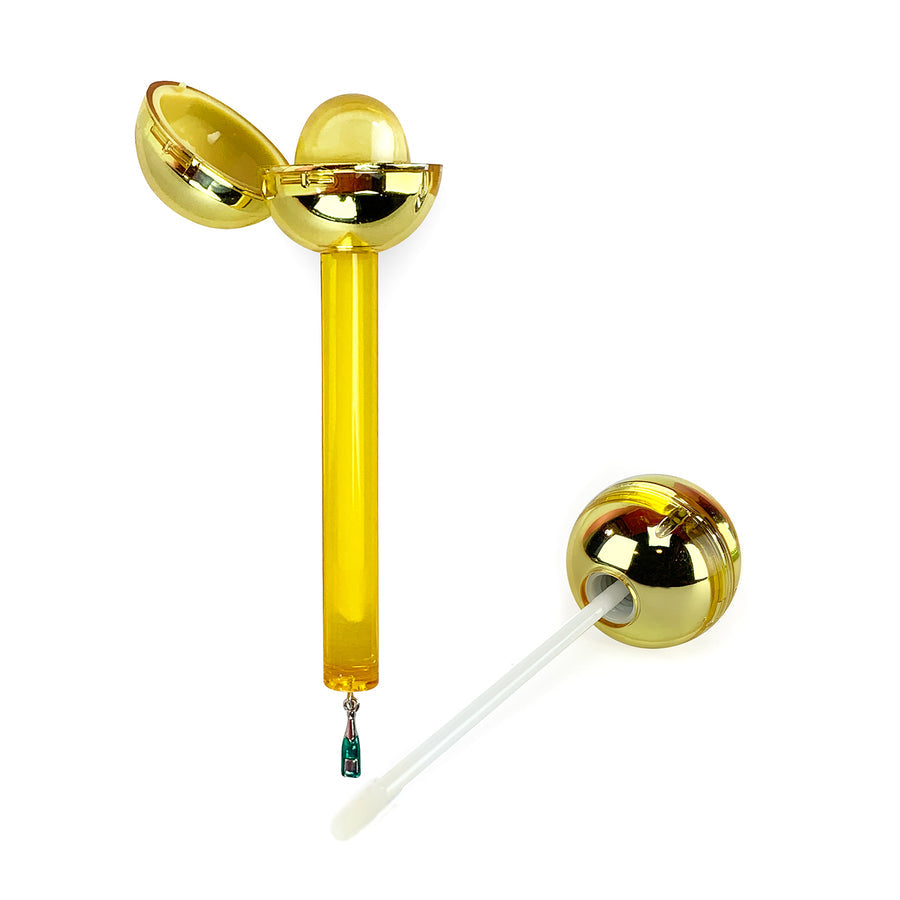 Glossy Pops Cheers lip gloss in a gold applicator with a unique ball design for a shiny finish