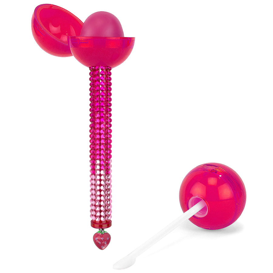 Glossy Pops TGI Fruity lip balm in a pink bejeweled container with a clear applicator for easy use