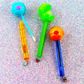 Glossy Pops TGI Fruity lip balm in colorful containers for moisturizing lips and fun application