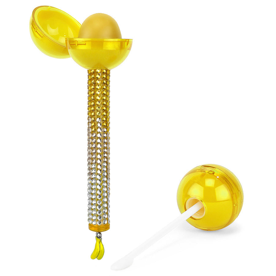 Glossy Pops TGI Fruity lip balm in yellow packaging with a sparkling handle and applicator brush