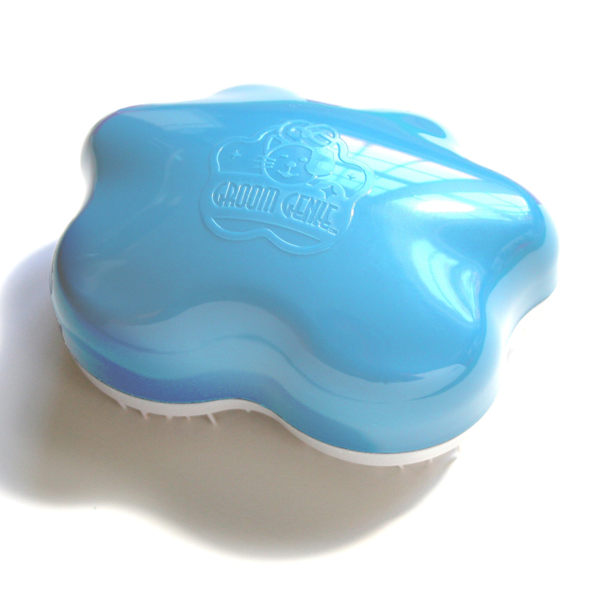 Groom Genie pet detangling brush in blue designed for easy grooming and detangling pet fur