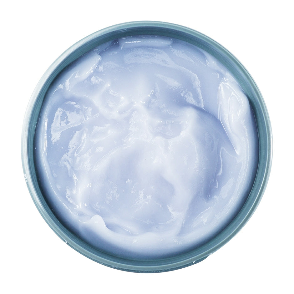 Johnny B. After Shave Balm in a blue container for soothing post-shave skin care