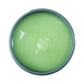 Johnny B Smooth Cream in a round container with a light green consistency for styling and smoothing hair