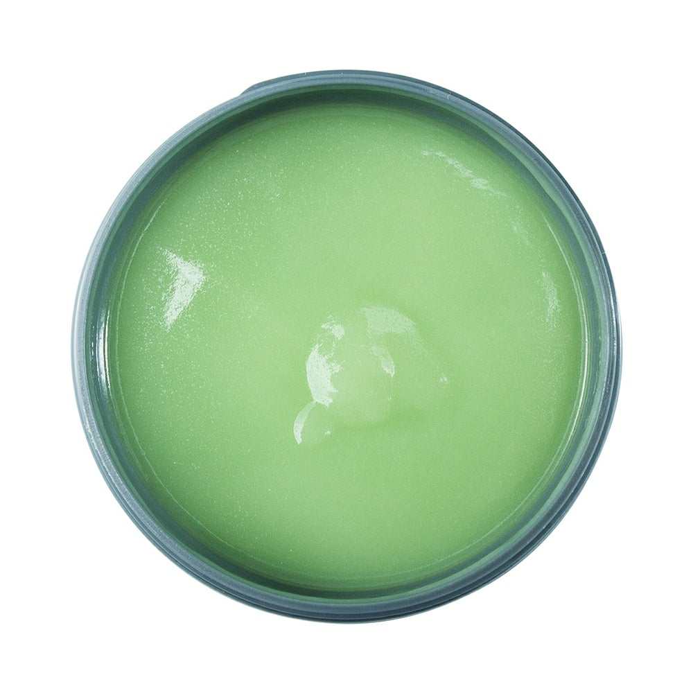 Johnny B Smooth Cream in a round container with a light green consistency for styling and smoothing hair