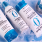Original Sprout Classic Shampoo surrounded by Original Sprout haircare products and bubbles in a vibrant setting