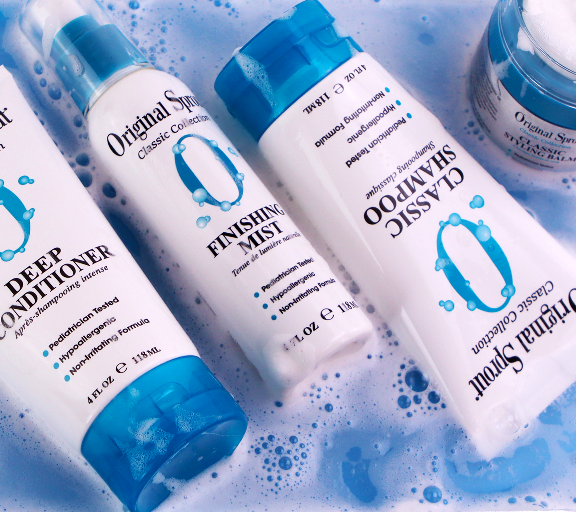 Original Sprout Classic Shampoo surrounded by Original Sprout haircare products and bubbles in a vibrant setting