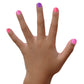 Colorful Piggy Paint gift set on a child's hand with pink and purple nail polish