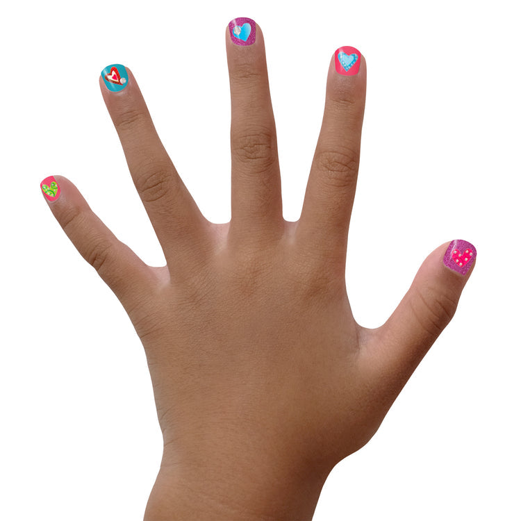 Colorful hand showcasing Piggy Paint nail art stickers with fun designs on nails