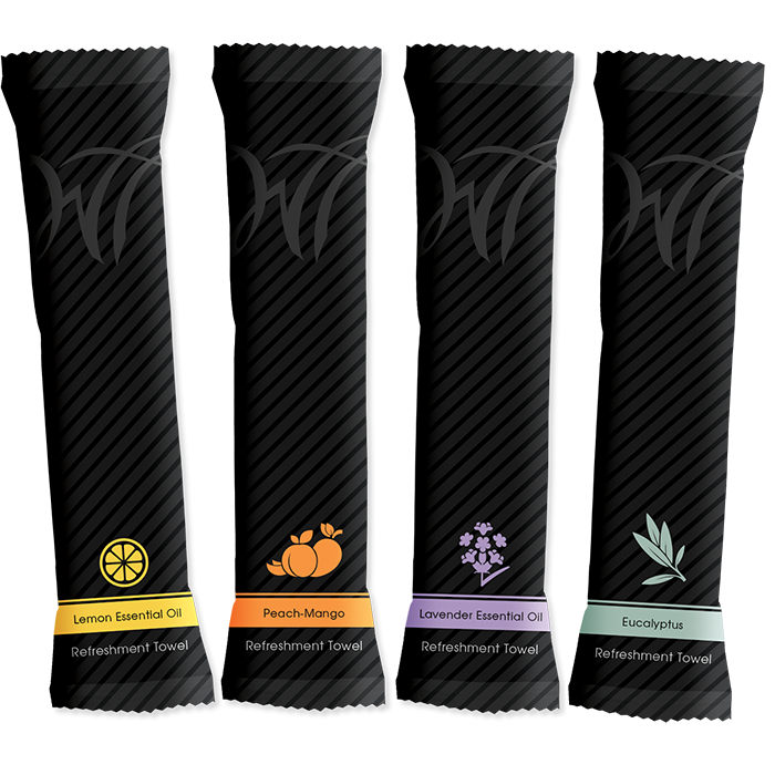 Four black refreshment towel packets, each labeled with a different scent: lemon, peach-mango, lavender, and eucalyptus.