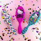 Wet Brush Hello Kitty detangler in three colorful designs with playful Hello Kitty characters