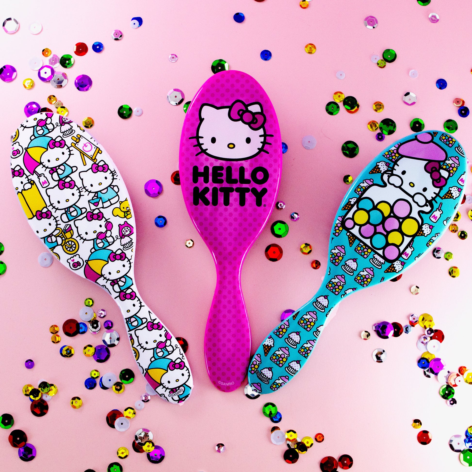 Wet Brush Hello Kitty detangler in three colorful designs with playful Hello Kitty characters