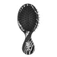 Wet Brush Mini Detangler featuring a sleek design for easy hair detangling on the go