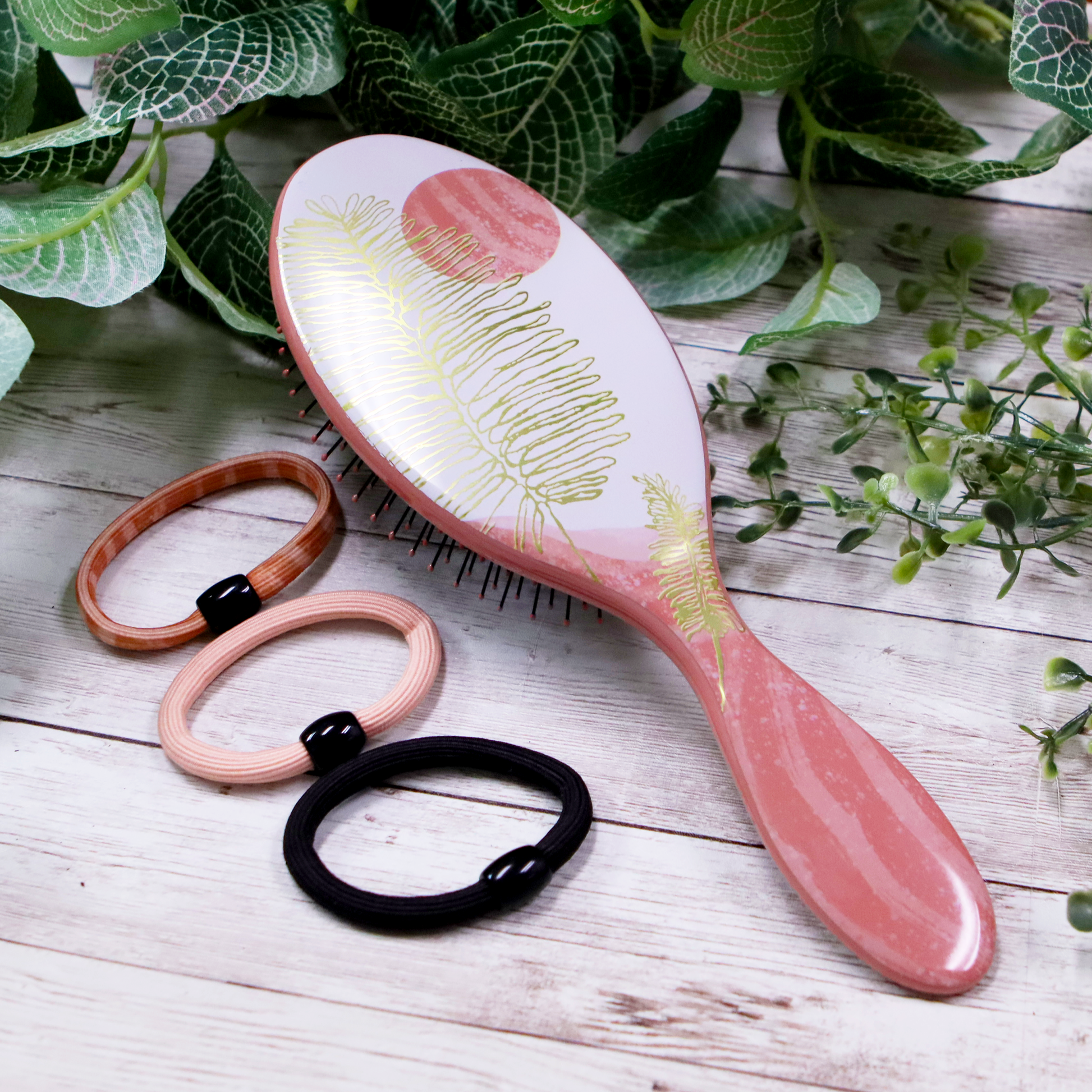 Wet Brush Pro Tranquil Beauty Kit featuring a brush and hair ties in a floral design